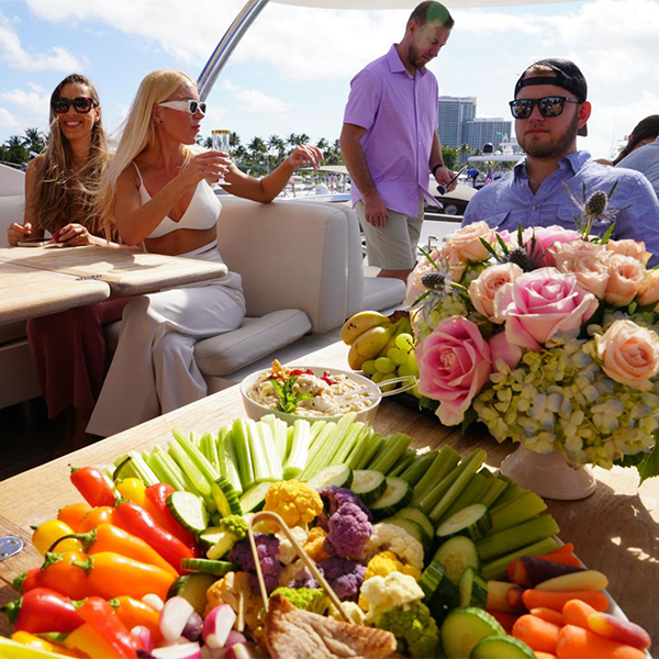 Peole siting in front plate full of food